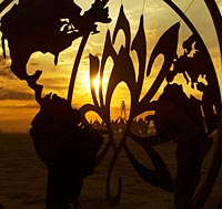Burning man Earth and flower metal sculpture