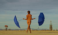 Hot girl dancing with umbrellas at Burning Man
