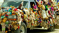 Picture of thousands of stuffed animals decorating the playa car