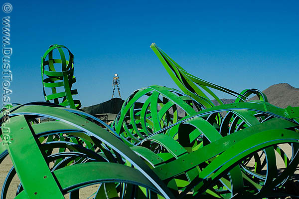 Broken sculpture of Green forest in front of the Burning Man