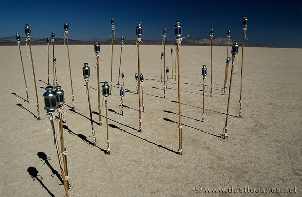 Field of blue lanterns in desert