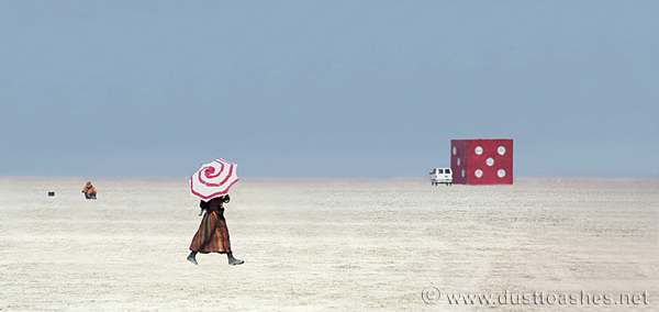 Super sized rolling die and lady with umbrella