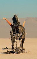Burning man sculpture of horses and girl's legs