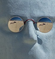 Burning Man Head with reflecting pair of glasses