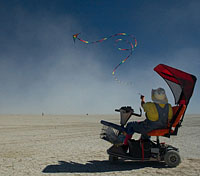 disabled man flying the kite in black rock desert