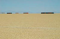 Lines of toilets in empty desert