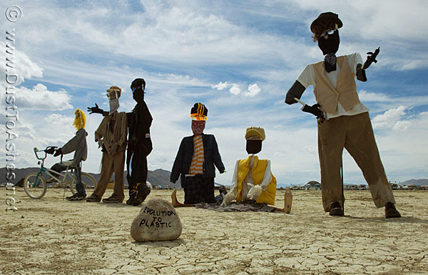 Desert art sculpture of group of plastic dolls