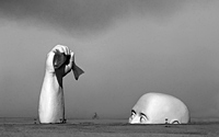 Fisherman in the desert surreal art sculpture