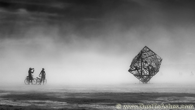 Black and White photo of cube art installation in dust storm