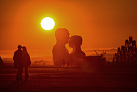 Silhouette of Embrace couple against the desert Sunrise