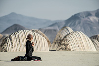 Girl meditating in desert