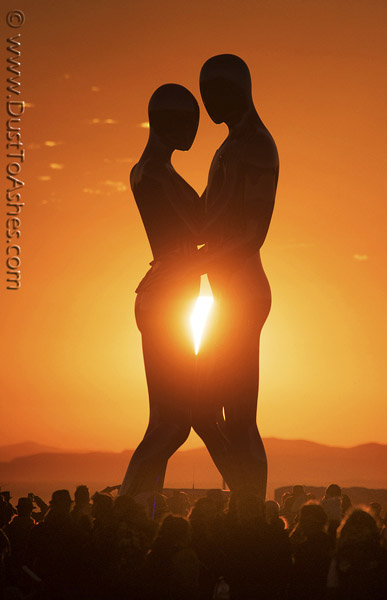 Man and woman in sunrise