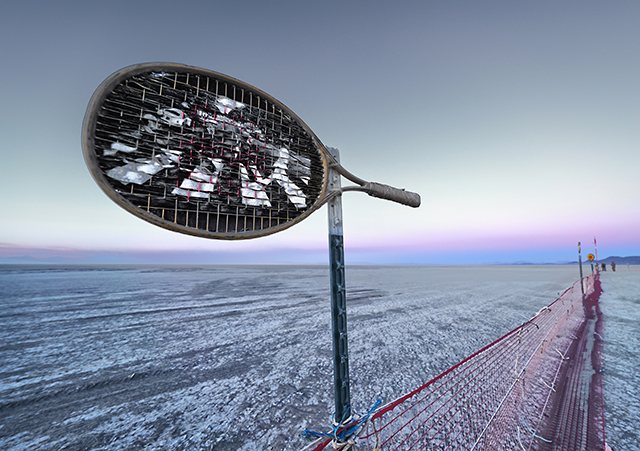 For the past 20 years, my friend Denny Smith, aka Dragnet, has been decorating the trash fence annually. This year, he used 75 tennis rackets to enhance the view of the open playa behind the fence.