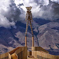 The heavy rain clouds forming in the mountains before the storm.