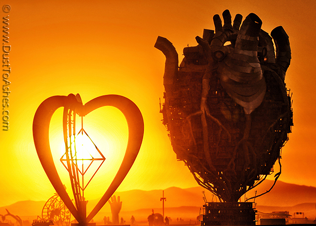 Optical alignment of 2 different heart sculptures during sunrise. One heart art installation is called Habitat and the second one is called Metaheart.