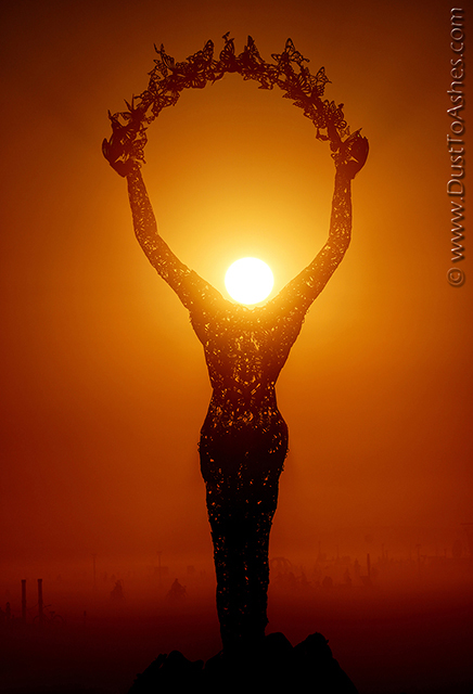 Art installation of a headless woman releasing the butterflies from hear risen hands